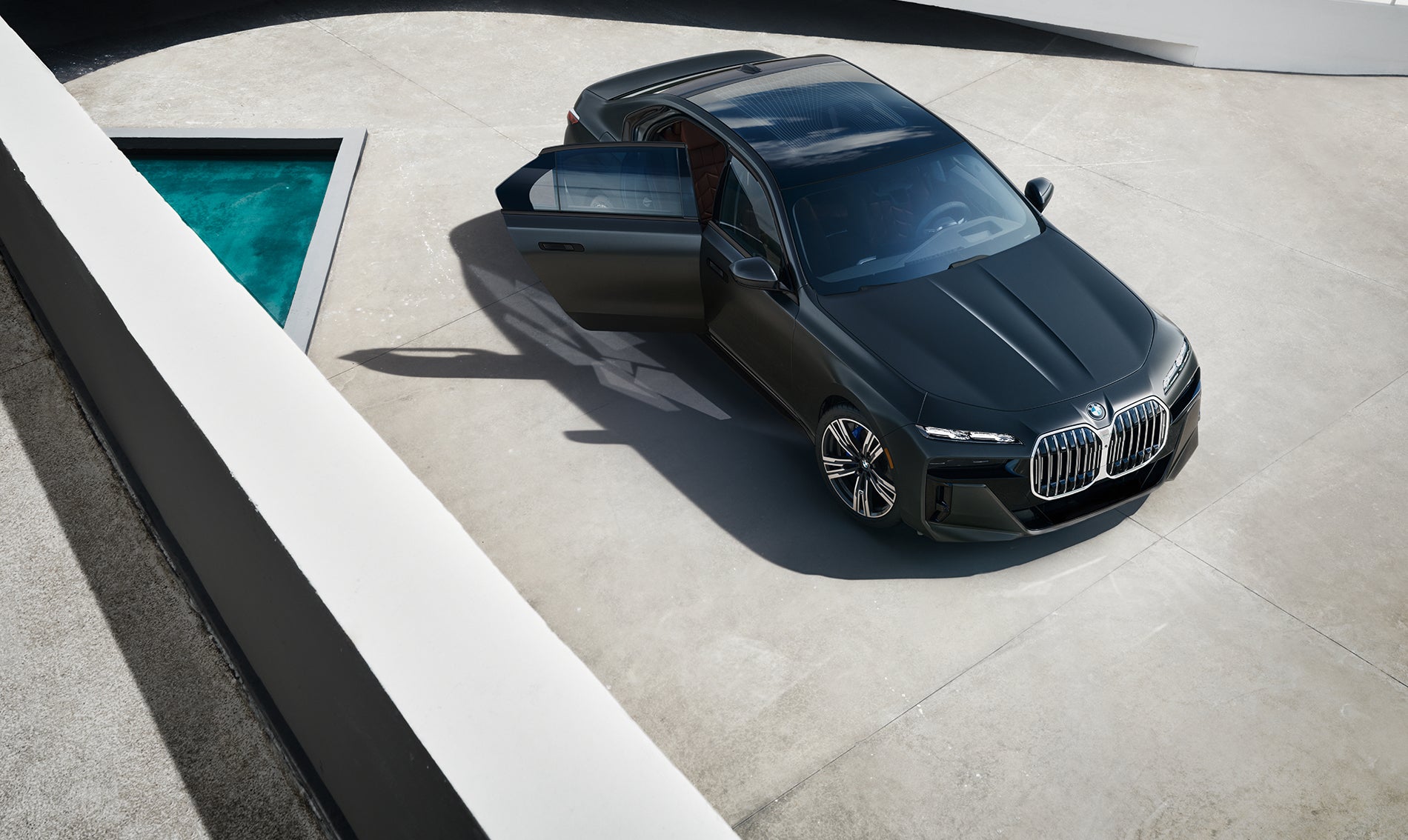 Aerial image of BMW i7 parked with rear door open