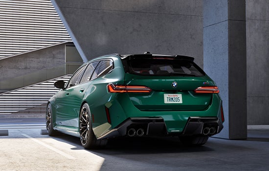 Green BMW M5 Touring parked in garage. | Flemington BMW in Flemington NJ