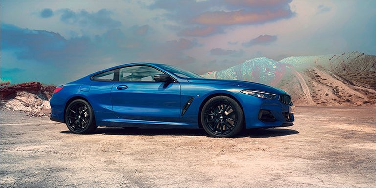 Blue BMW 8 Series parked with desert landscape | Flemington BMW in Flemington NJ