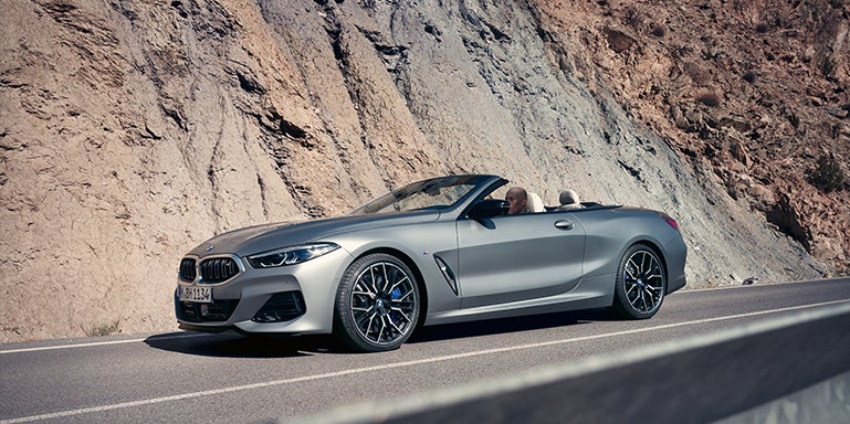 Grey BMW convertible driving around a mountain | Flemington BMW in Flemington NJ