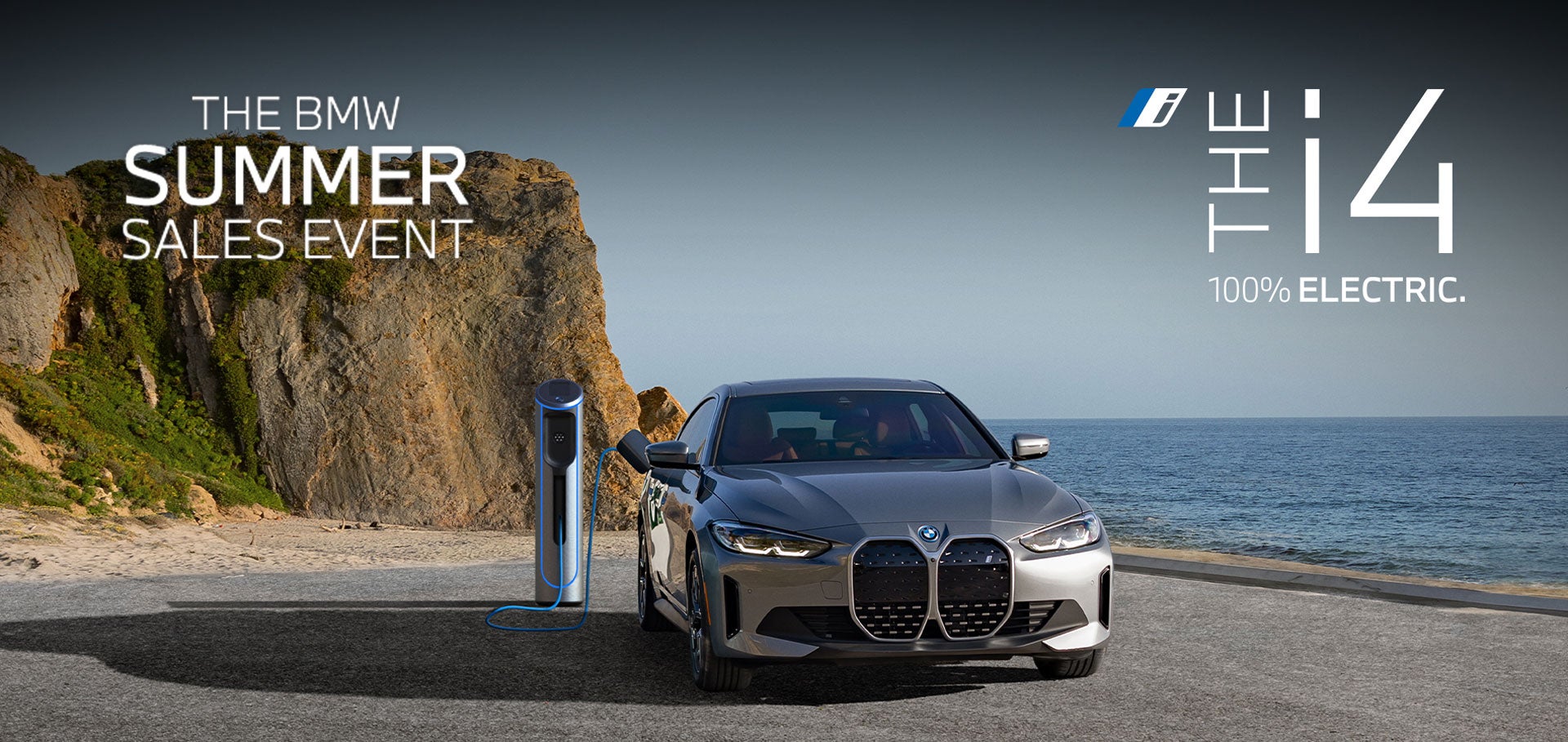 Charging BMW i4 parked in coastal landscape