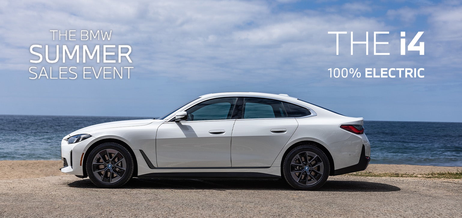 Parked BMW i4 parked on the seaside.