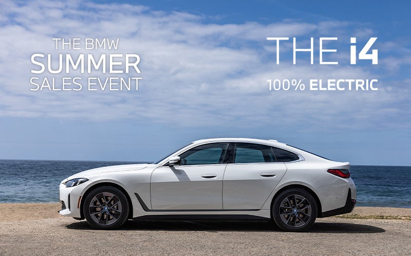 Parked BMW i4 parked on the seaside.