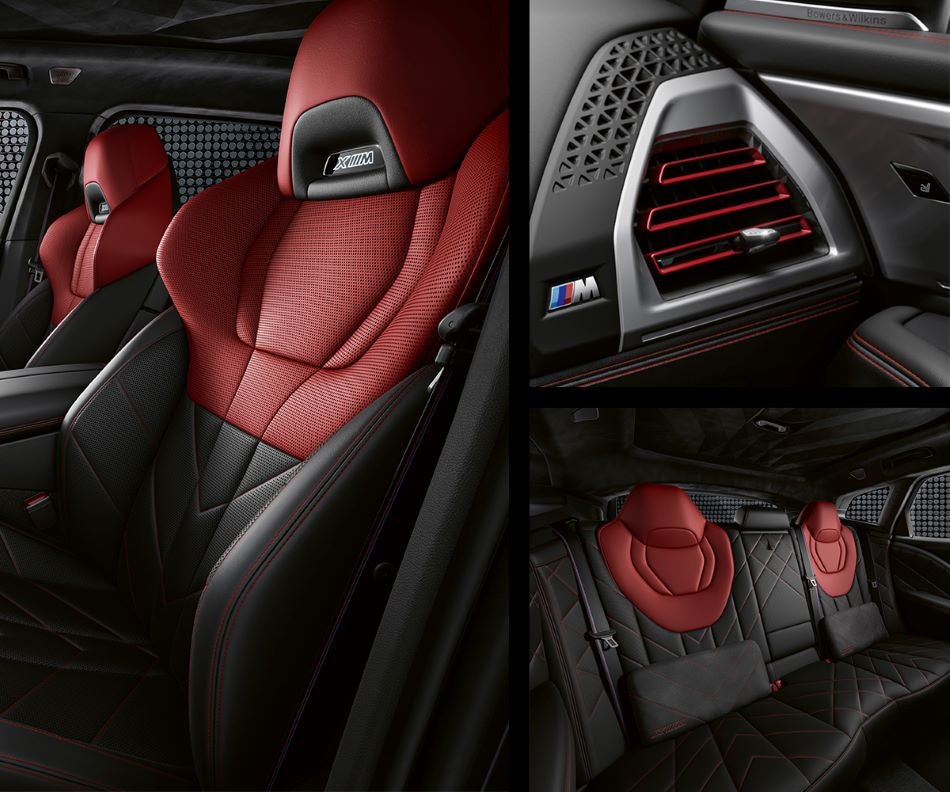 Detail of front seats, clad in exclusive BMW Individual Fiona Red & Black Merino Leather with exclusive M Signature Trim and red stitching and accents. Detail of red accented vent. Detail of rear M Lounge with exclusive XM pillows in Flemington BMW | Flemington NJ